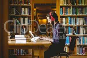 Hipster student studying in library