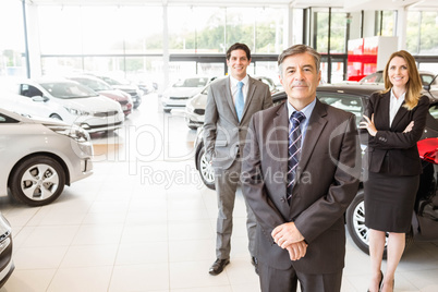 Group of smiling business team standing together