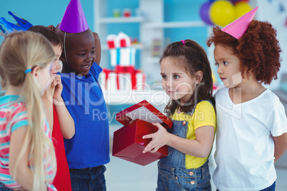 Happy girl opening a present