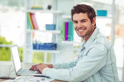 Creative businessman working on his laptop