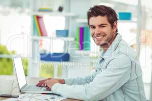 Creative businessman working on his laptop