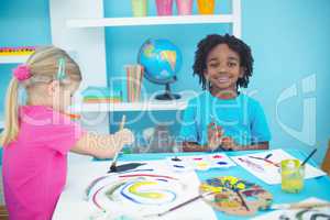 Happy kids enjoying arts and crafts painting