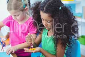 Girls making arts and crafts together