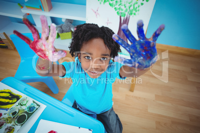 Happy kid enjoying arts and crafts painting