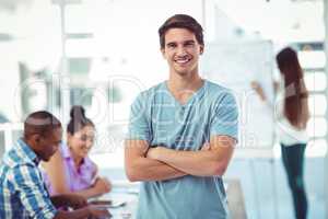 Young creative worker smiling at camera