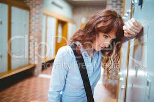 Mature student feeling stressed in hallway