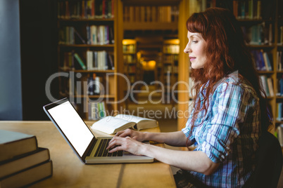 Mature student studying in library