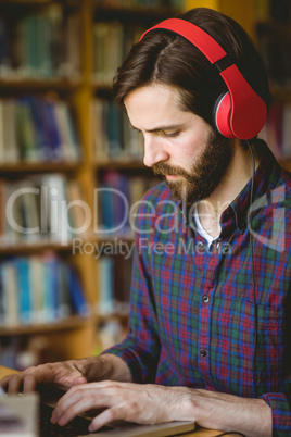 Hipster student studying in library