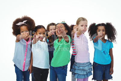 Line of girls standing with hands pointing ahead