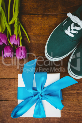 View of sneakers and blue gift