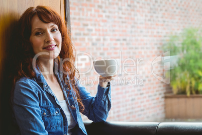 Mature student having coffee in cafe