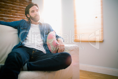 Casual man relaxing on his sofa