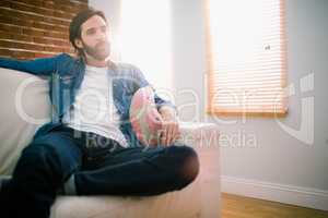 Casual man relaxing on his sofa