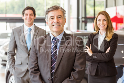 Group of smiling business team standing together