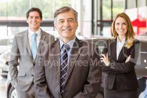 Group of smiling business team standing together