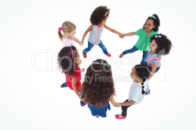 Smiling girls all holding each others hands