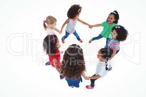 Smiling girls all holding each others hands
