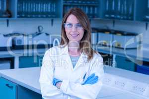 Scientist smiling at the camera in lab