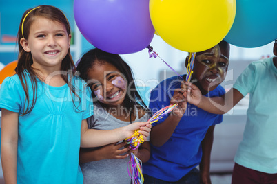 Happy kids playing with balloons