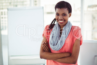 Smiling creative businesswoman by her desk