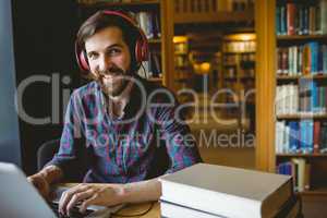 Hipster student studying in library