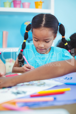 Small girl drawing a picture