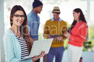 Young creative worker smiling at camera