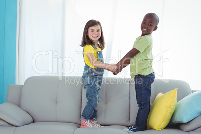 Happy boy and girl standing up