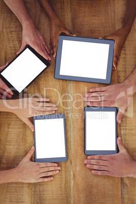 Creative team working together on a tablet and smartphones