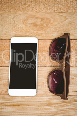 View of glasses and a smartphone