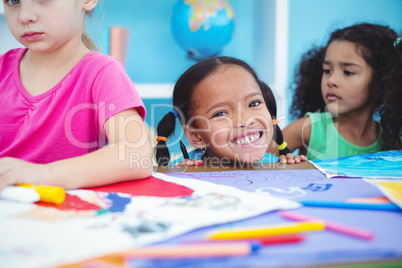 Happy kids all drawing pictures