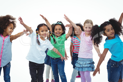 Girls standing with arms spread out