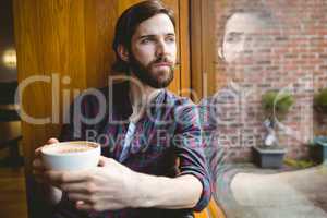 Hipster student having coffee in canteen