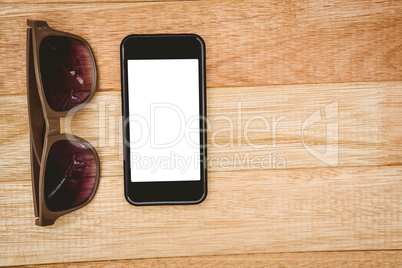 View of glasses and a smartphone