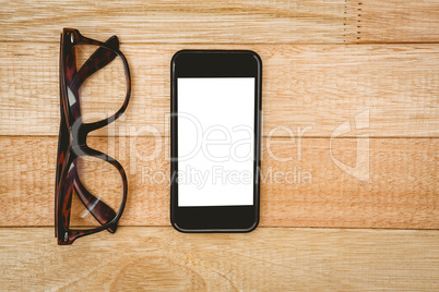 View of glasses and a smartphone