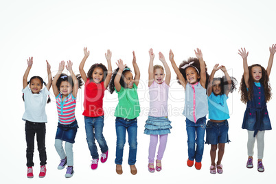 Line of girls standing with arms raised Line of girls standing with arms raised