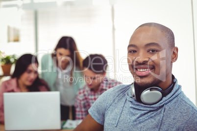 Young creative worker using tablet