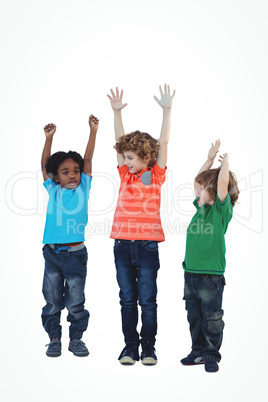 A row of children standing together with raised arms