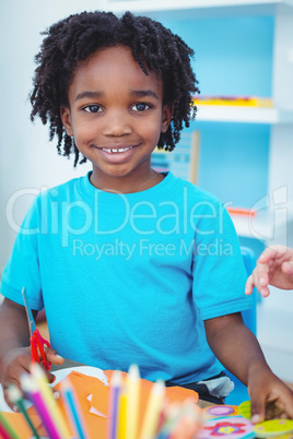 Happy kid enjoying arts and crafts painting