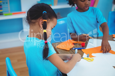 Happy kids enjoying arts and crafts painting