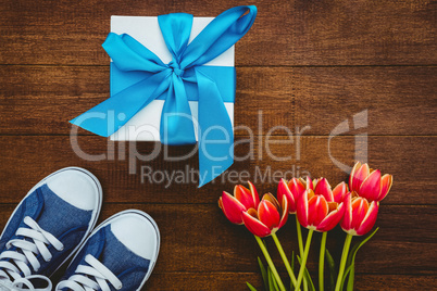 View of sneakers and blue gift