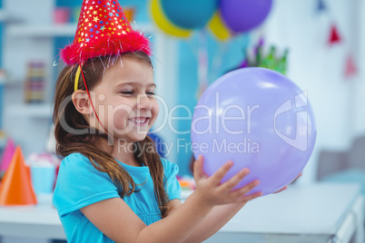 Happy kid holding a balloon