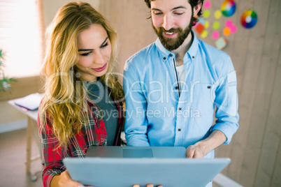 Creative team working with laptop