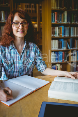 Mature student studying in library