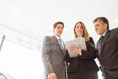 Group of smiling business team standing together