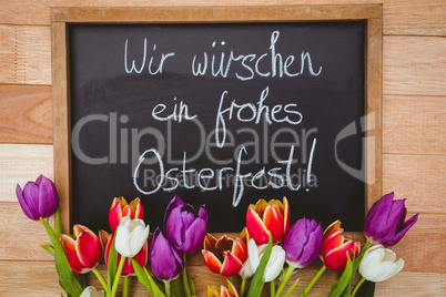 Bouquet of colored flowers against black board