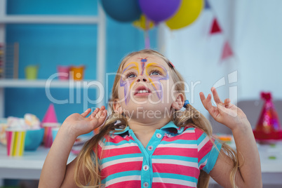 Happy girl with her face painted