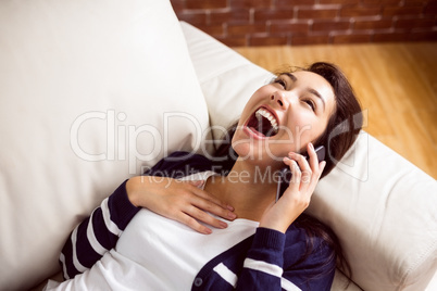 Asian woman laughing on the phone