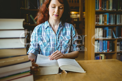 Mature student studying in library