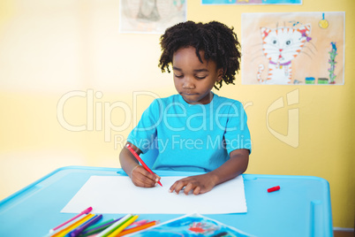 School kid drawing on a sheet
